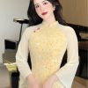 Áo dài thiết kế 4 tà họa tiết hoa nhí, chất liệu vải tơ lót hoa lụa, đính trang trí nút bọc may thủ công cao cấp 19 e54d96a411c846efb3b572bf885e0c2atplv aphluv4xwc origin jpeg